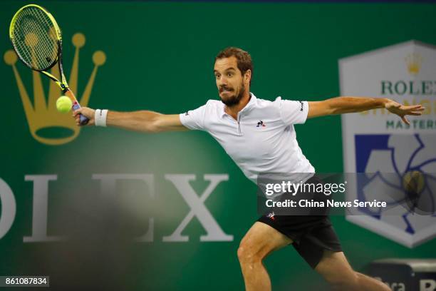 Richard Gasquet of France returns a shot during the Men's singles quarterfinal mach against Roger Federer of Switzerland on day six of 2017 ATP...