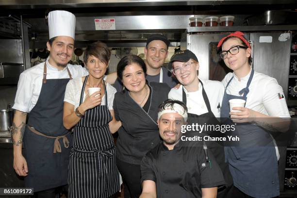 Chefs Alex Guarnaschelli and Dominique Crenn pose with their team during a Dinner with Dominique Crenn and Alex Guarnaschelli part of the Bank of...