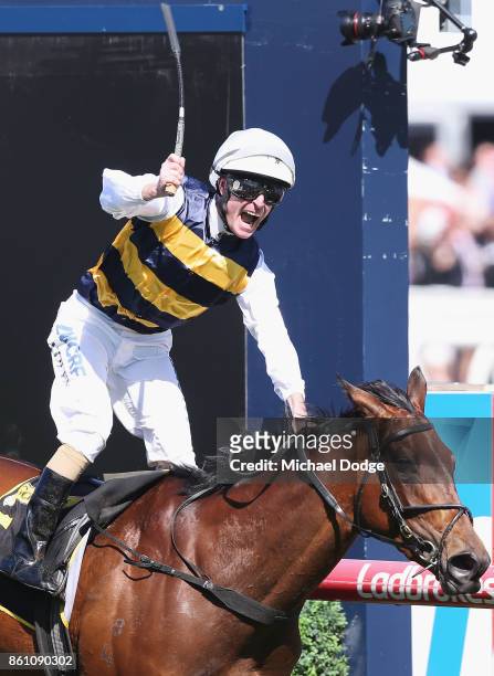 Jockey Luke Nolen riding Aloisia celebrates winning race 6 the Schweppes Thousand Guineas during Melbourne Racing on Caulfield Guineas Day at...