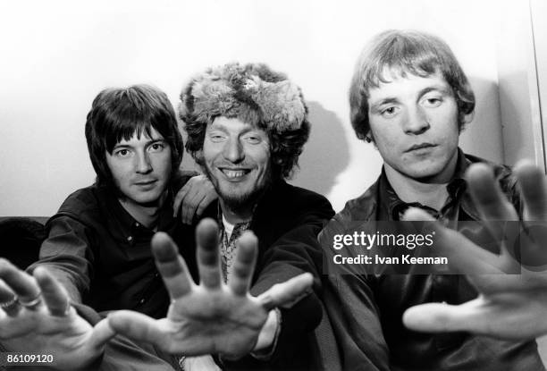 From left, Eric Clapton, Ginger Baker and Jack Bruce of British rock group Cream posed in their dressing room at Associated Rediffusion's Wembley...