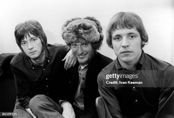 From left, Eric Clapton, Ginger Baker and Jack Bruce of British rock group Cream posed in their dressing room at Associated Rediffusion's Wembley...