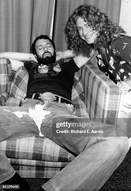 Photo of LED ZEPPELIN and Robert PLANT, Robert Plant backstage with a roadie covered in cream cakes