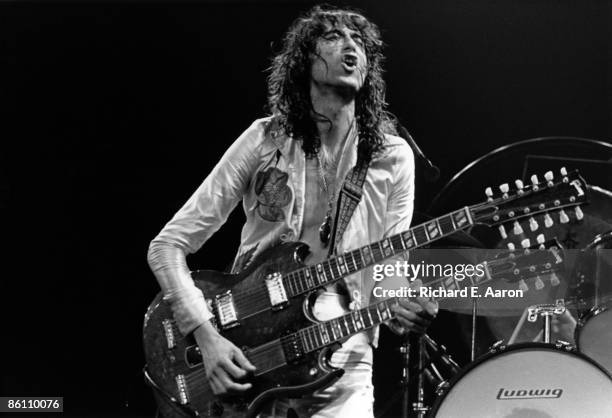 Photo of Jimmy PAGE and LED ZEPPELIN, Jimmy Page performing live onstage during the 1977 US tour , playing Gibson EDS-1275 twin-neck/double-neck...