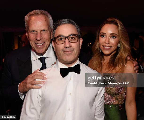 Steve Tisch, Jason Weinberg and Katia Francesconi attend the amfAR Gala Los Angeles 2017 at Ron Burkle's Green Acres Estate on October 13, 2017 in...