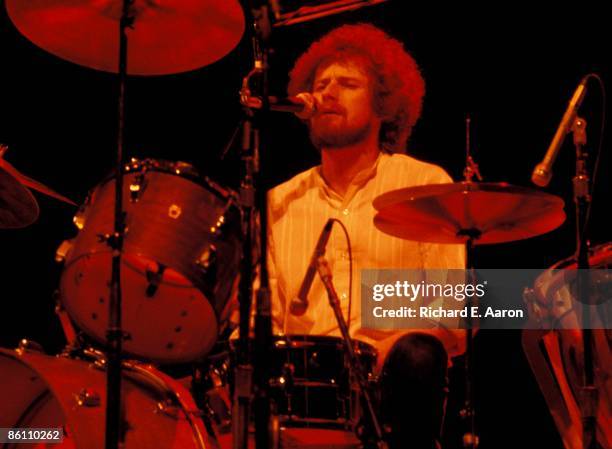 Photo of Don HENLEY and EAGLES; Don Henley performing live onstage on Hotel California tour, playing drums and singing