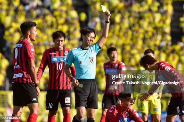 Cristiano of Kashiwa Reysol is shown a yellow card by referee Masaaki Iemoto the J.League J1 match between Consadole Sapporo and Kashiwa Reysol at...