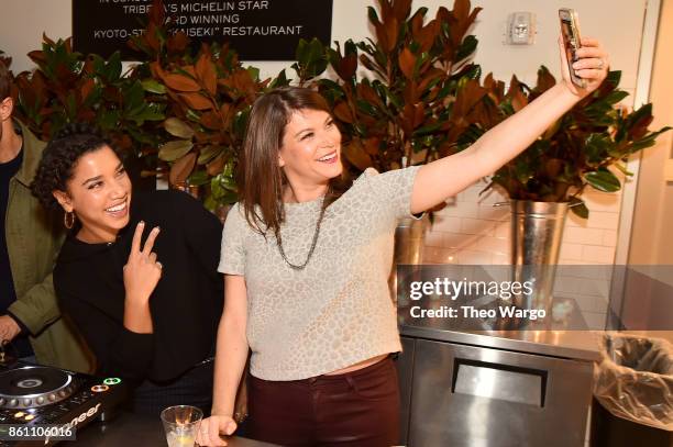 Hannah Bronfman and Food Writer Gail Simmons pose for a selfie during Late Night Adventures in Dean & DeLuca hosted by Hannah Bronfman and Gail...