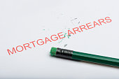 Word 'Mortgage Arrears' with Worn Pencil Eraser and Shavings