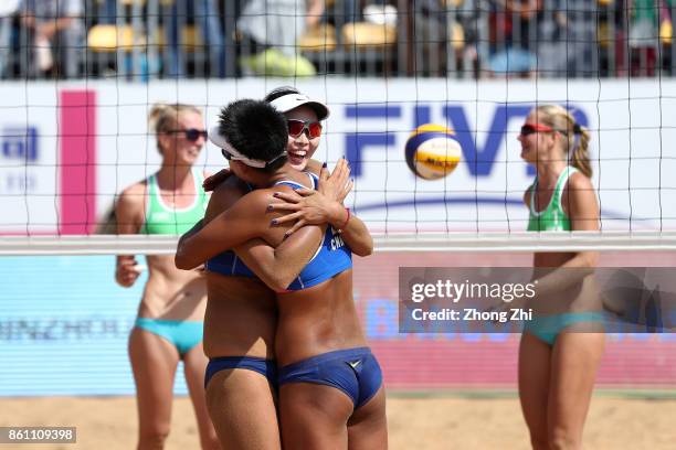 Wang Fan and Xia Xinyi of China celebrate winning the match against Valentyna Davidova and Levgeniia Shchypkova of Ukraine on Day 4 of FIVB Beach...