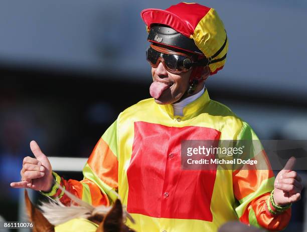 Jockey Michael Walker riding Mighty Boss celebrates winning race 8 the Ladbrokes Caulfield Guineas during Melbourne Racing on Caulfield Guineas Day...