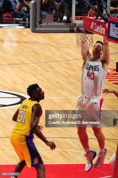 Marshall Plumlee of the LA Clippers goes up for a dunk against the Los Angeles Lakers on October 13, 2017 at STAPLES Center in Los Angeles,...