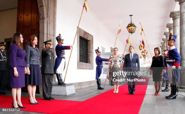 Honduras' President Juan Orlando Hernandez and first lady Ana Garcia, enter the Palace of Carondelet during a state visit, in Quito, Ecuador, October...