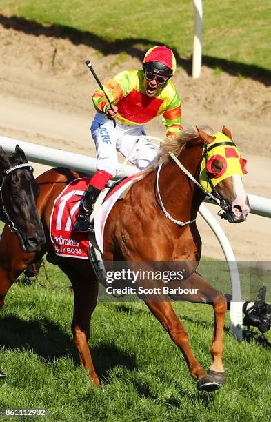 Jockey Michael Walker riding Mighty Boss celebrates as he wins race 8 the Ladbrokes Caulfield Guineas during Melbourne Racing on Caulfield Guineas...