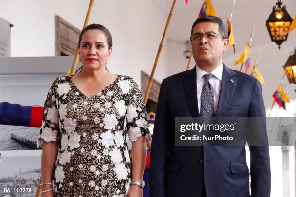 Honduras' President Juan Orlando Hernandez and first lady Ana Garcia, enter the Palace of Carondelet during a state visit, in Quito, Ecuador, October...