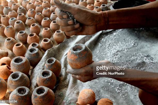 Traditional fire cracker makers preparing fire crackers before supply it to the market for sale at Bhingarpur village ahead of the festival of lights...