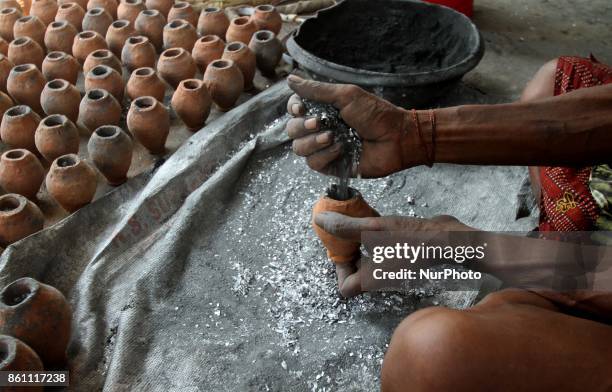 Traditional fire cracker makers preparing fire crackers before supply it to the market for sale at Bhingarpur village ahead of the festival of lights...