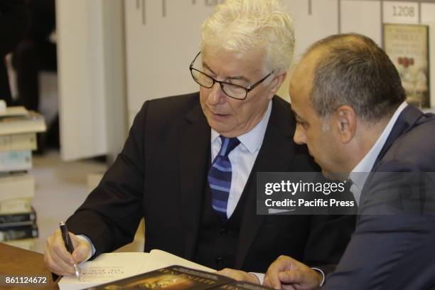 Welsh author Ken Follett signs a book for a fan. The Frankfurt Book Fair 2017 is the world largest book fair with over 7,000 exhibitors and over...