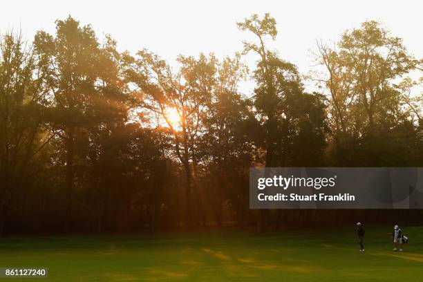 Lee Westwood of England and his caddie, Billy Foster walk down the 1st during day three of the 2017 Italian Open at Golf Club Milano - Parco Reale di...