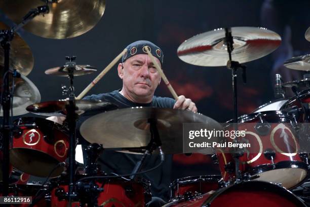 Photo of Neil PEART and RUSH, Neil Peart performing live on stage