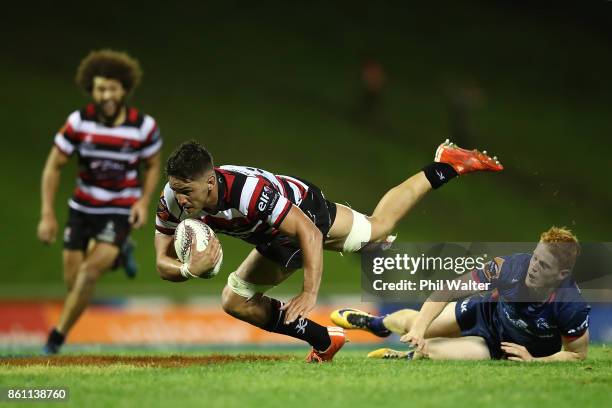 Samuel Henwood of Counties is tackled by Finlay Christie of Tasman during the round nine Mitre 10 Cup match between Counties Manukau and Tasman at...