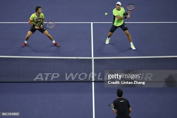 Jean-Julien Rojer of Netherland and Horia Tecau of Romania in action duirng the Men's Doubles Semifinal mach against Marcelo Melo of Brazil and...