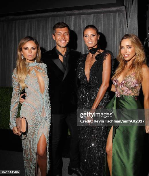 Erica Pelosini, Heidi Klum, and Katia Francesconi attend amfAR Los Angeles 2017 at Ron Burkle's Green Acres Estate on October 13, 2017 in Beverly...