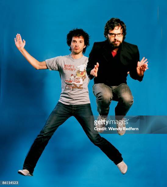 Photo of Bret McKENZIE and FLIGHT OF THE CONCHORDS and Jemaine CLEMENT; Posed studio group portrait of Bret McKenzie and Jemaine Clement, jumping