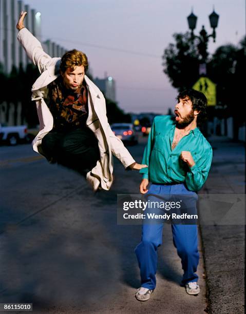 Photo of Bret McKENZIE and FLIGHT OF THE CONCHORDS and Jemaine CLEMENT; Posed studio group portrait of Bret McKenzie and Jemaine Clement, jumping