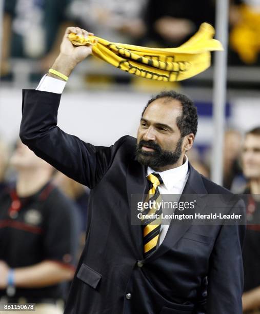 Franco Harris waves a Pittsburgh Steelers' "Terrible Towel" as he is introduced with other former Super Bowl MVPs in pregame ceremonies for Super...