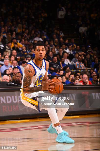 Michael Gbinije of the Golden State Warriors handles the ball during preseason game against the Sacramento Kings on October 13, 2017 at ORACLE Arena...