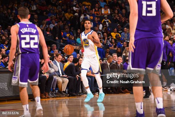 Michael Gbinije of the Golden State Warriors handles the ball on during preseason game against the Sacramento Kings on October 13, 2017 at ORACLE...