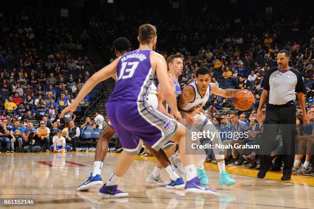 Michael Gbinije of the Golden State Warriors handles the ball during preseason game against the Sacramento Kings on October 13, 2017 at ORACLE Arena...