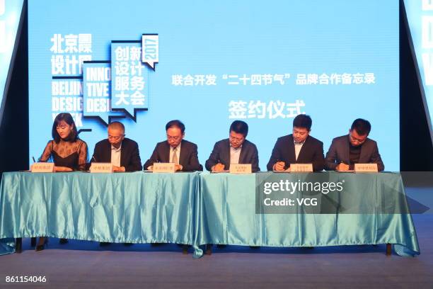 Participants sign cooperation during an award ceremony as part of 2017 Beijing Design Week on September 23, 2017 in Beijing, China. Beijing Design...