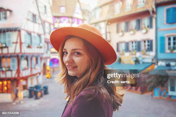 young woman enjoying christmas in colmar, france - strasbourg winter stock pictures, royalty-free photos & images