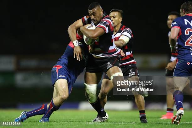 Jimmy Tupou of Counties is tackled during the round nine Mitre 10 Cup match between Counties Manukau and Tasman at ECOLight Stadium on October 14,...