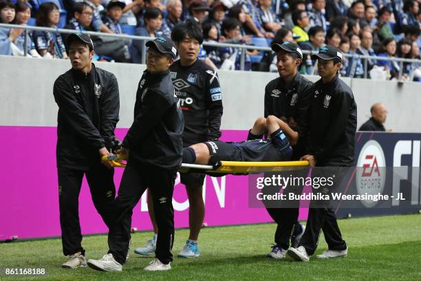 Oh Jae Suk of Gamba Osaka is taken off by stretcher during the J.League J1 match between Gamba Osaka and Albirex Niigata at Suita City Football...