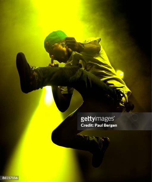 Photo of Pharrell WILLIAMS and NERD, Pharrell Williams performing on stage, jumping