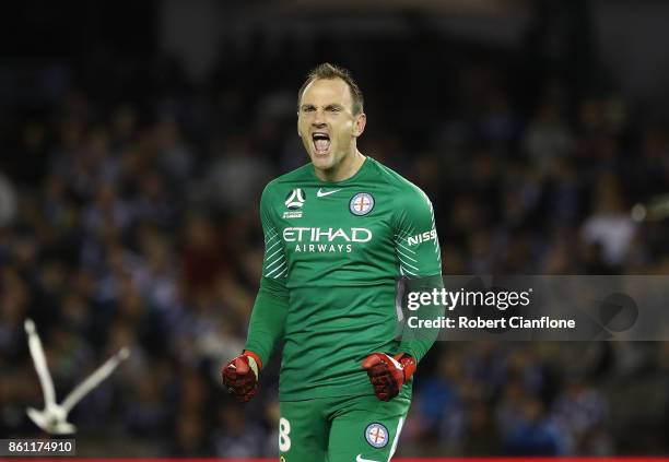 City goalkeeper Eugene Galekovic celebrates the goal of team mate Bruce Kamau during the round two A-League match between Melbourne Victory and...