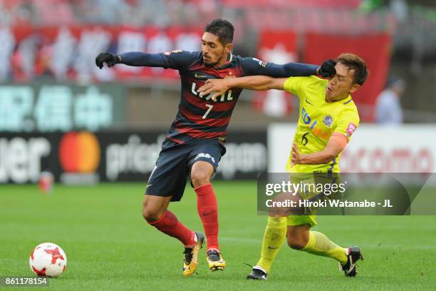 Pedro Junior of Kashima Antlers and Toshihiro Aoyama of Sanfrecce Hiroshima compete for the ball during the J.League J1 match between Kashima Antlers...