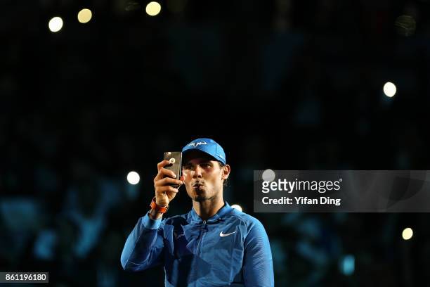 Rafael Nadal of Spain takes pictures after winning his Men's singles semi-final match against Marin Cilic of Croatia on day 7 of 2017 ATP Shanghai...
