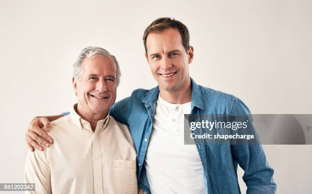 cant beat that father son bond - putting arm around shoulder stock pictures, royalty-free photos & images