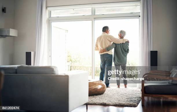 happily ever after - old woman by window stock pictures, royalty-free photos & images