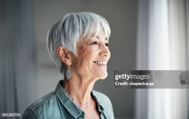 the joys of retirement - older woman short hair stock pictures, royalty-free photos & images