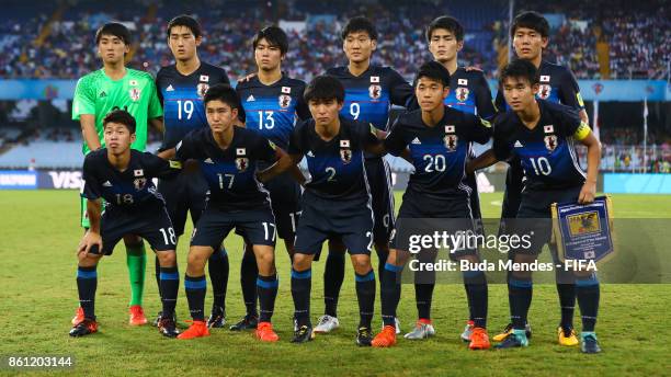 The Japan team line up for a picture during the FIFA U-17 World Cup India 2017 group E match between Japan and New Caledonia at Vivekananda Yuba...