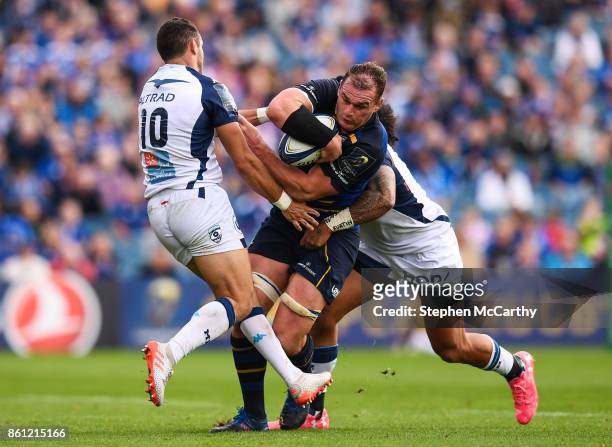 Dublin , Ireland - 14 October 2017; Rhys Ruddock of Leinster in action against Thomas Darmon, left, and Joseph Tomane of Montpellier during the...