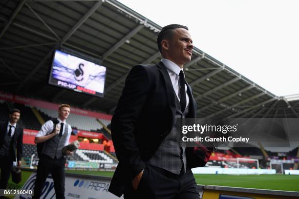 Roque Mesa of Swansea City arrives at the stadium prior to the Premier League match between Swansea City and Huddersfield Town at Liberty Stadium on...