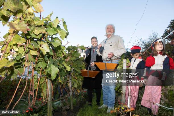 Actress Sarah Biasini and singer Hugues Aufray attend the 84th 'Fete des Vendanges' on October 14, 2017 in Paris, France.