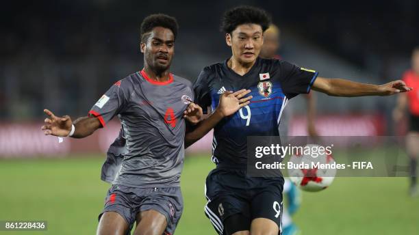 Hiroto Yamada of Japan battles for the ball with Kiam Wanesse of New Caledonia during the FIFA U-17 World Cup India 2017 group E match between Japan...