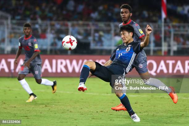 Hiroto Yamada of Japan kicks the ball during the FIFA U-17 World Cup India 2017 group E match between Japan and New Caledonia at Vivekananda Yuba...