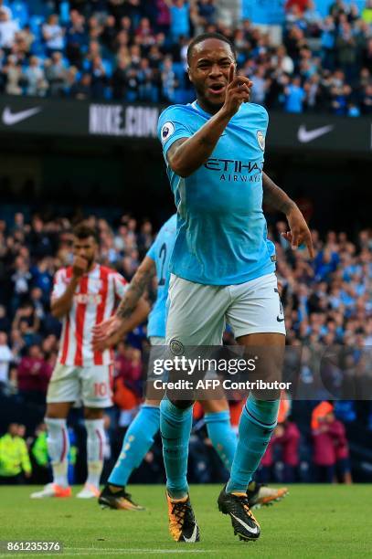 England's midfielder Raheem Sterling celebrates scoring their second goal during the English Premier League football match between Manchester City...